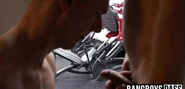  Athletic young men swap head and rimming in the gym